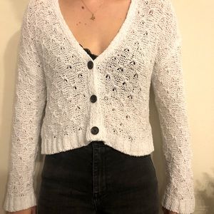 Cropped white cardigan.